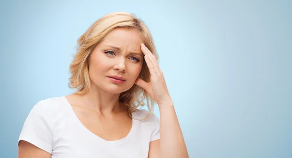 Unhappy woman suffering from headache — Stock Photo, Image