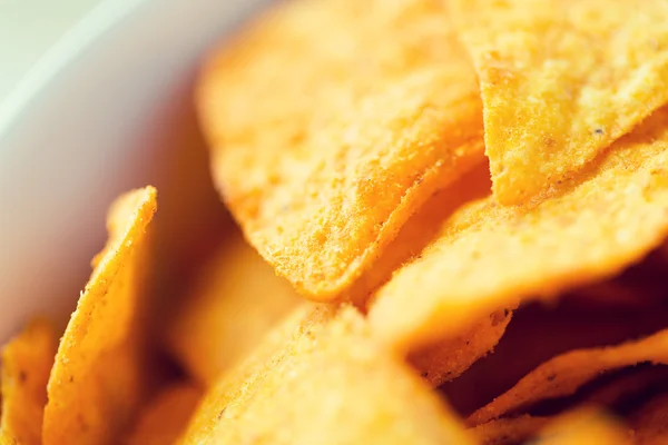 Close up of corn crisps or nachos in bowl — Stock Photo, Image
