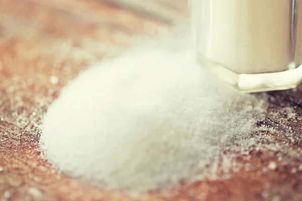 Close up of white salt cellar on wooden table — Stock Fotó