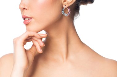 close up of beautiful woman face with earring clipart