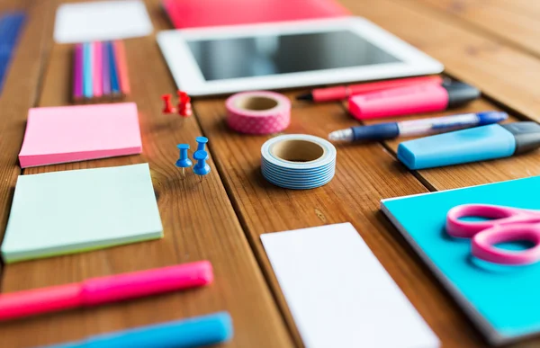 Close up of school supplies and tablet pc — Stock Photo, Image