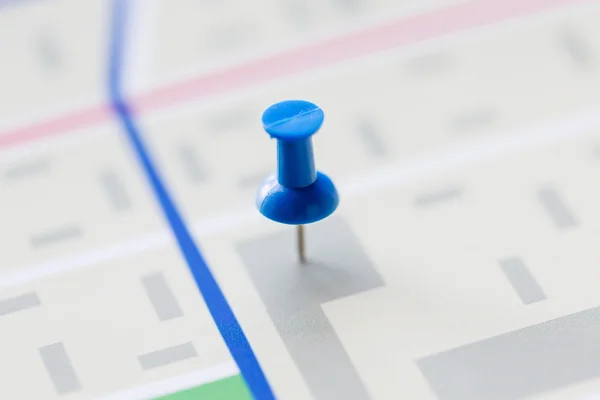 Close up of map or city plan with pin — Stock Photo, Image