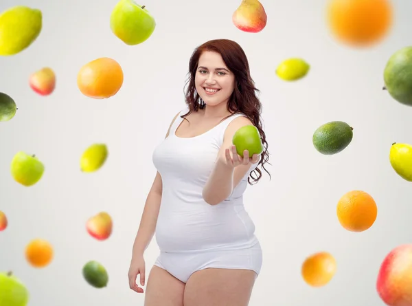 Glada plus size kvinna i underkläder med äpple — Stockfoto