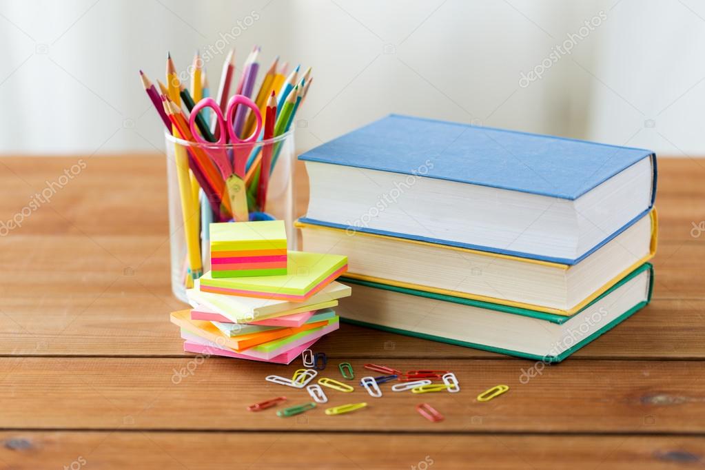 Close up of pens, books, clips and stickers Stock Photo by  ©Syda_Productions 107972908