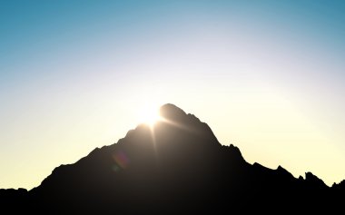silhouette of mountain top over sky and sun light clipart