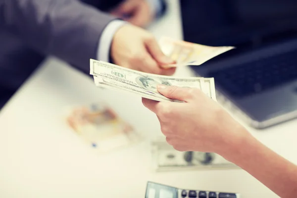 Close up of hands giving or exchanging money — Stock Photo, Image