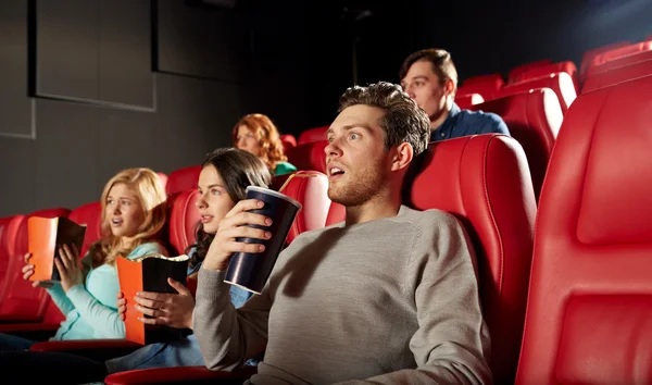 Friends watching horror movie in theater — Stock Photo, Image