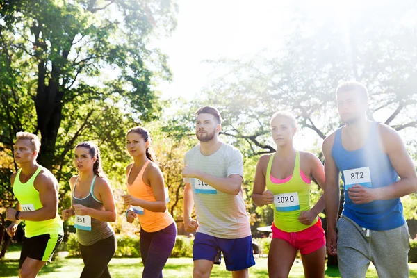 Sportsmen with badge numbers on start of race — Stock Photo, Image