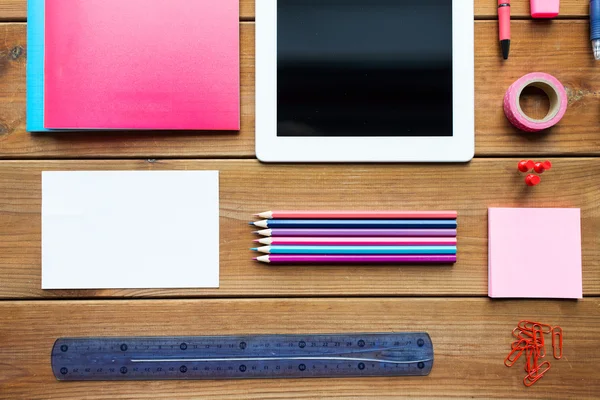 Close up of school supplies and tablet pc — Stock Photo, Image