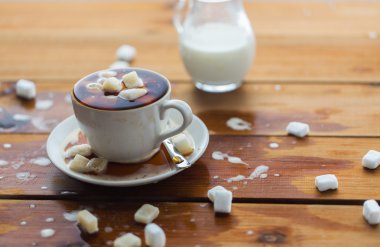close up of sugar in coffee cup on wooden table clipart