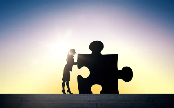 Silhouette of woman moving puzzle over sun light — Stock Photo, Image