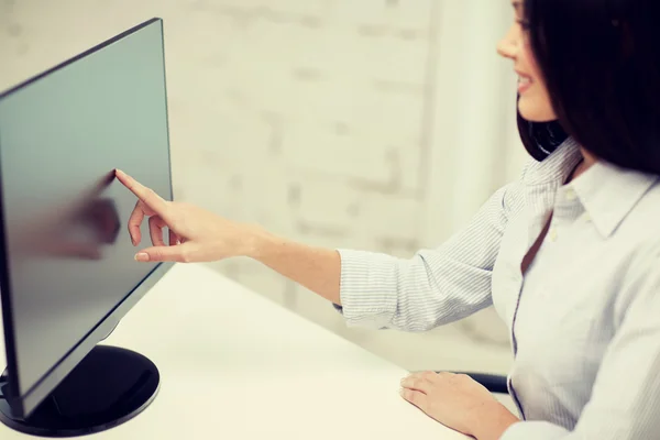 Close up of woman with computer monitor in office — Stock Photo, Image