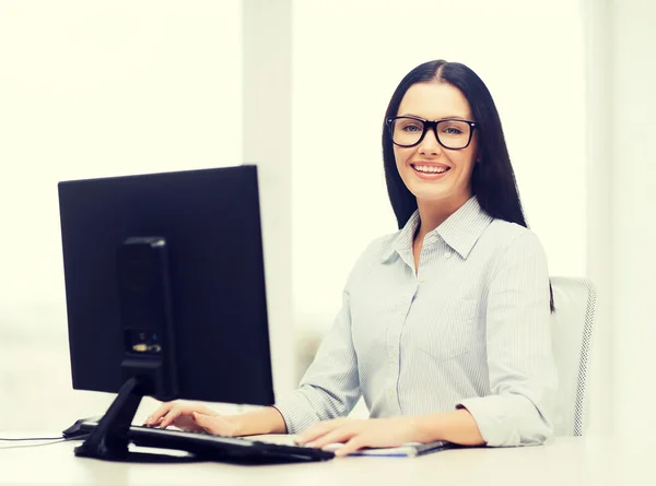 Smiling businesswoman or student with eyeglasses — Stock Photo, Image