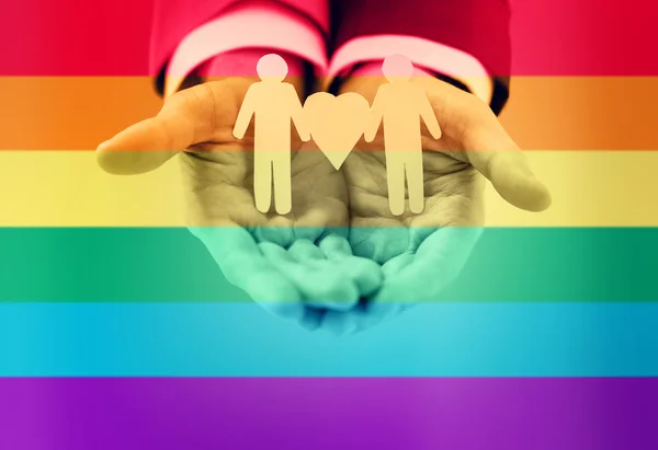 Close up of happy male gay couple with love symbol — Stock Photo, Image