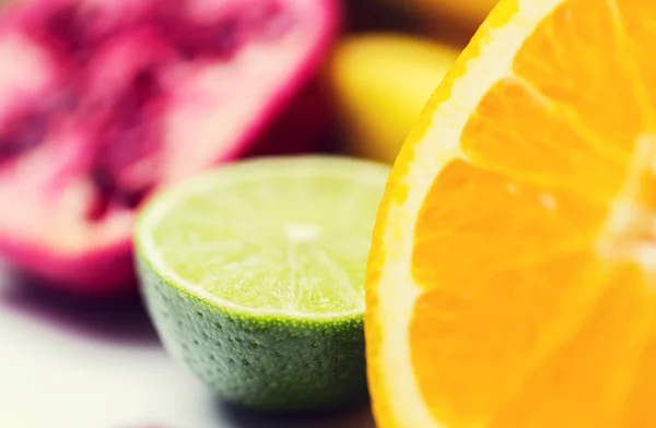 Close up of fresh juicy orange and lime — Stock Photo, Image