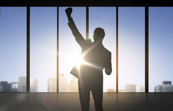 Silhouette of business man over office background — Stock Photo, Image