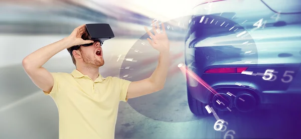 Man in virtual reality headset and car racing game — Stock Photo, Image