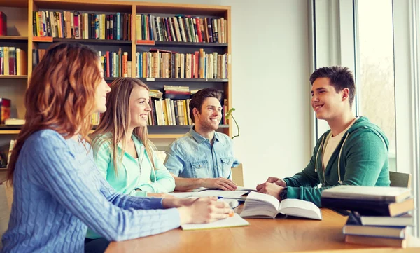 Students with books preparing to exam in library — Stock Photo, Image