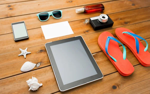 Close up of tablet pc and travel stuff — Stock Photo, Image