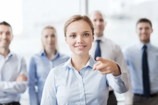 Smiling businesswoman pointing finger on you Royalty Free Stock Photos