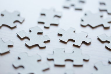 close up of puzzle pieces on table clipart