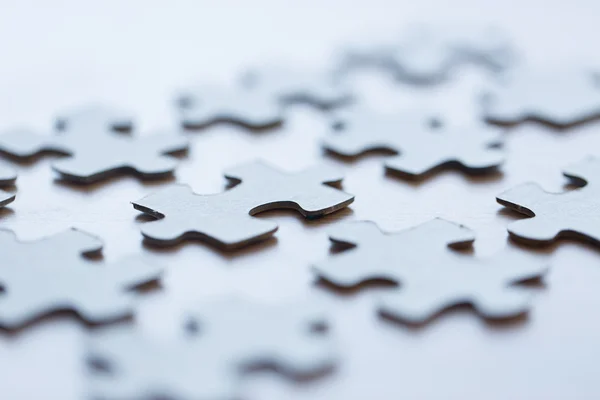 close up of puzzle pieces on table