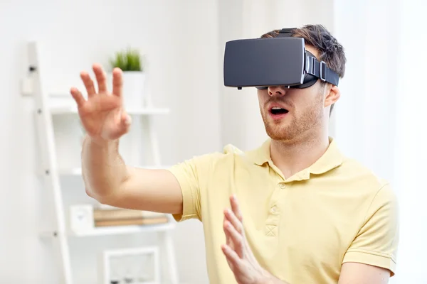 Young man in virtual reality headset or 3d glasses — Stock Photo, Image