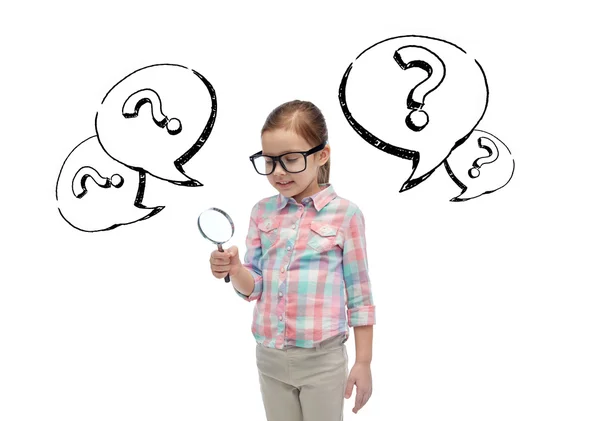 Little girl in eyeglasses with magnifying glass — Stock Photo, Image