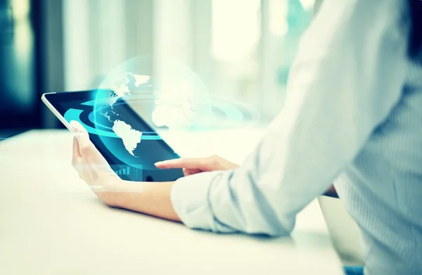 close up of woman hands with tablet pc at office