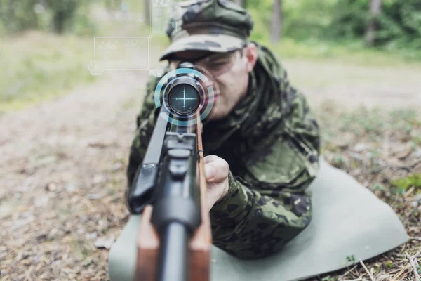 Close up of soldier or sniper with gun in forest — Stock Photo, Image