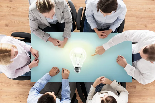 Close up of business team sitting at table — Stock Photo, Image