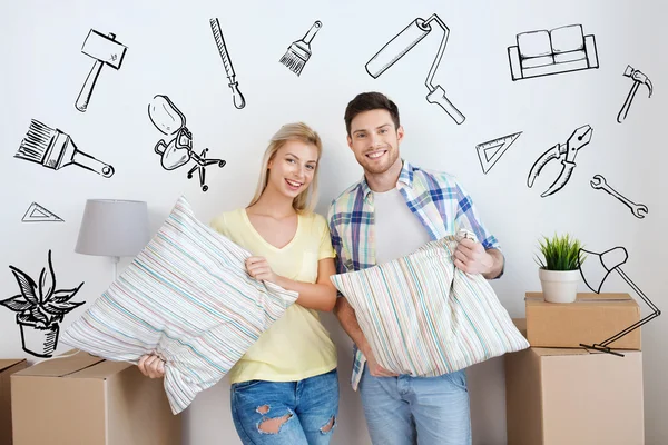 Happy couple with stuff moving to new home — Stock Photo, Image