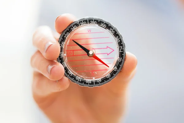 Close up of woman hand holding compass — Stock Photo, Image
