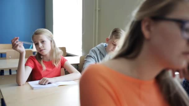 Students with notebooks on lesson at school — Stock Video