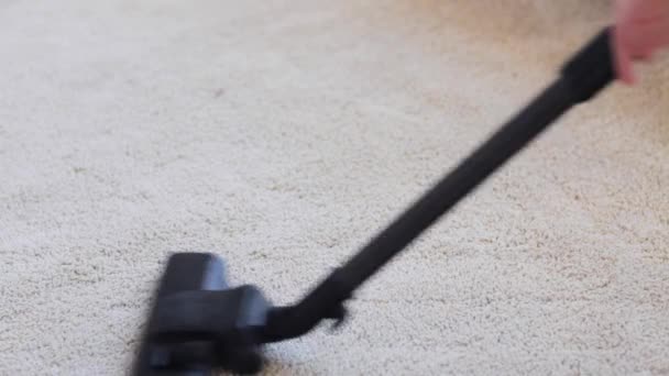 Woman with vacuum cleaner cleaning carpet at home — Stock Video