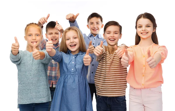 Happy children showing thumbs up Stock Photo