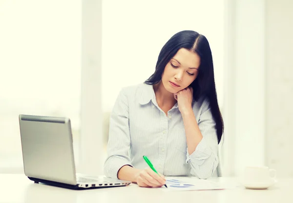 Tired businesswoman or student with laptop Stock Image