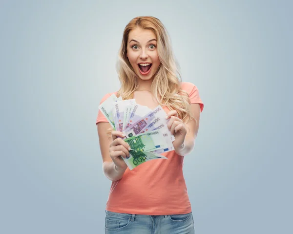 Gelukkig jonge vrouw met euro contant geld — Stockfoto