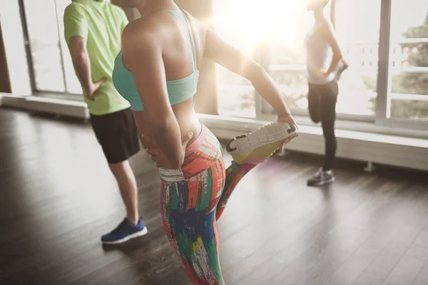 close up of people exercising in gym