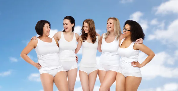 Grupp glada olika kvinnor i vita underkläder — Stockfoto
