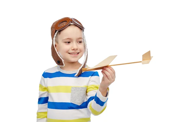 Happy little boy in aviator hat with airplane — Stock Photo, Image