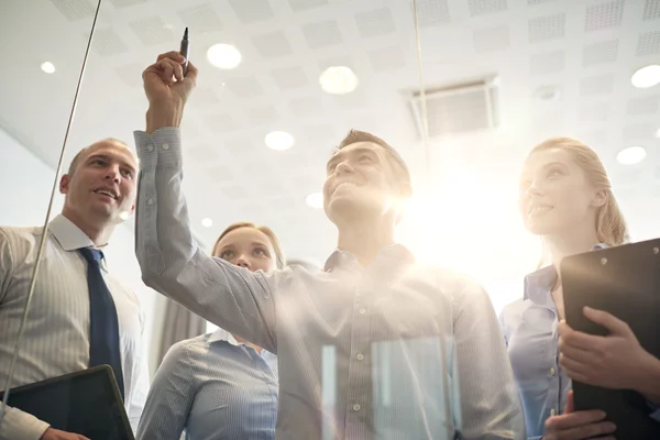 Smiling business people with marker and stickers — Stock Photo, Image