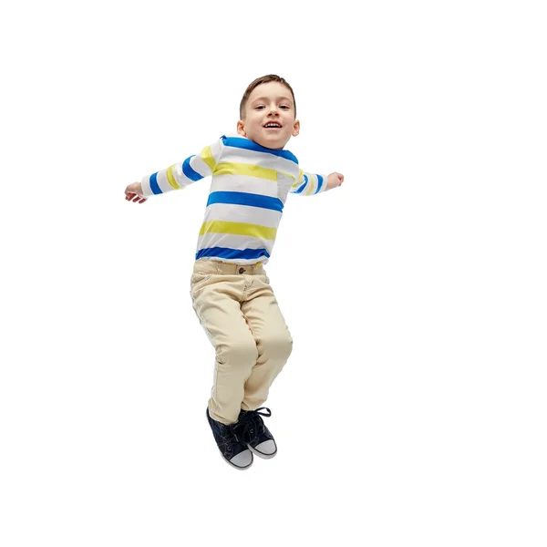 Happy little boy jumping in air — Stock Photo, Image