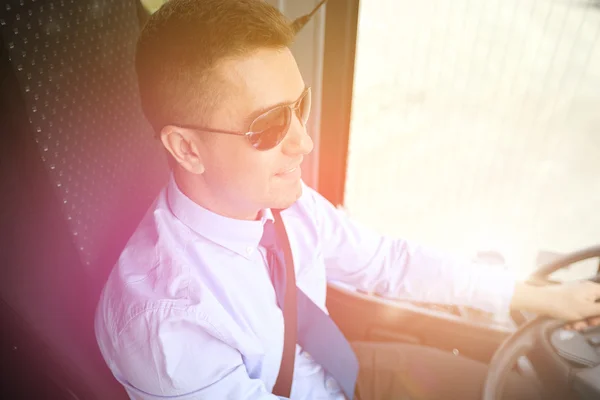 Happy driver driving intercity bus — Stock Photo, Image