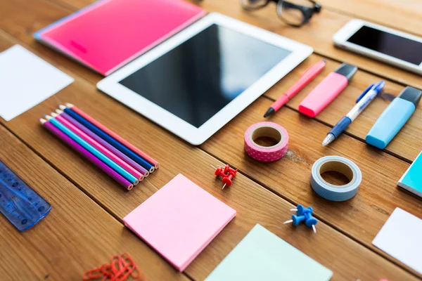 Close up of school supplies and tablet pc — Stock Photo, Image