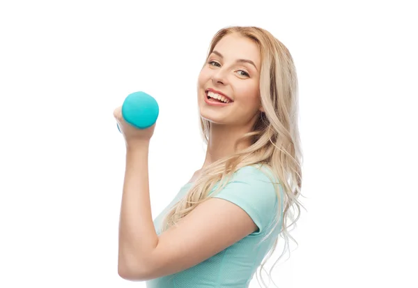 Smiling beautiful young sporty woman with dumbbell — Stock Photo, Image