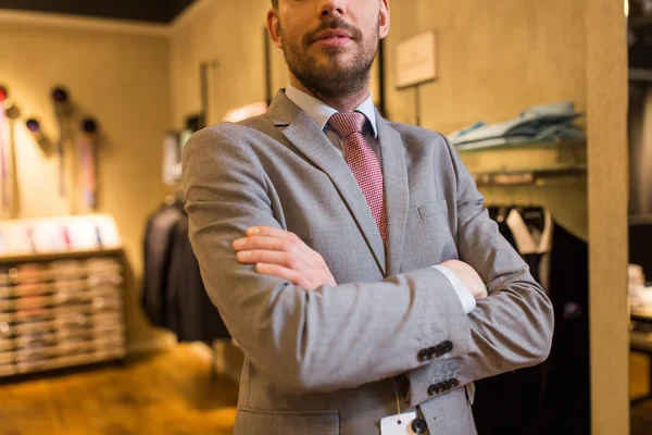 Close up of man in suit and tie at clothing store — Stock Photo, Image