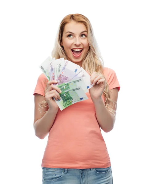 Gelukkig jonge vrouw met euro contant geld — Stockfoto