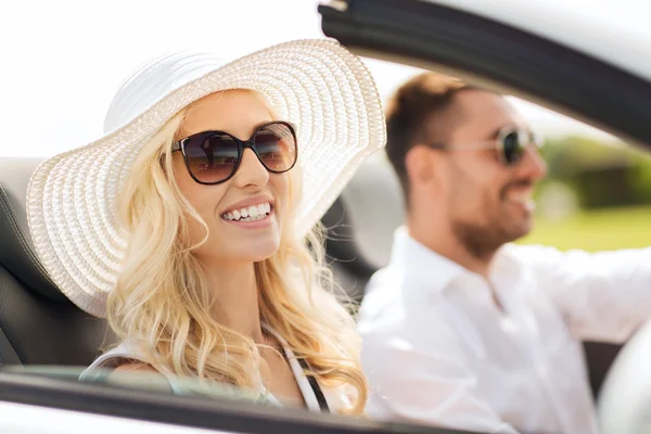 Happy man and woman driving in cabriolet car — Stock Photo, Image