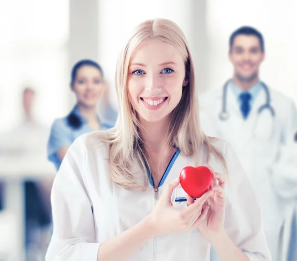 Female doctor with heart — Stock Photo, Image